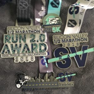 All of the medals from the Food Truck 5k and Silicon Valley Half, including the bonus bling