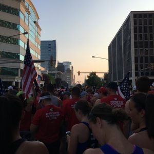 Team RWB raises the flags at the starting line